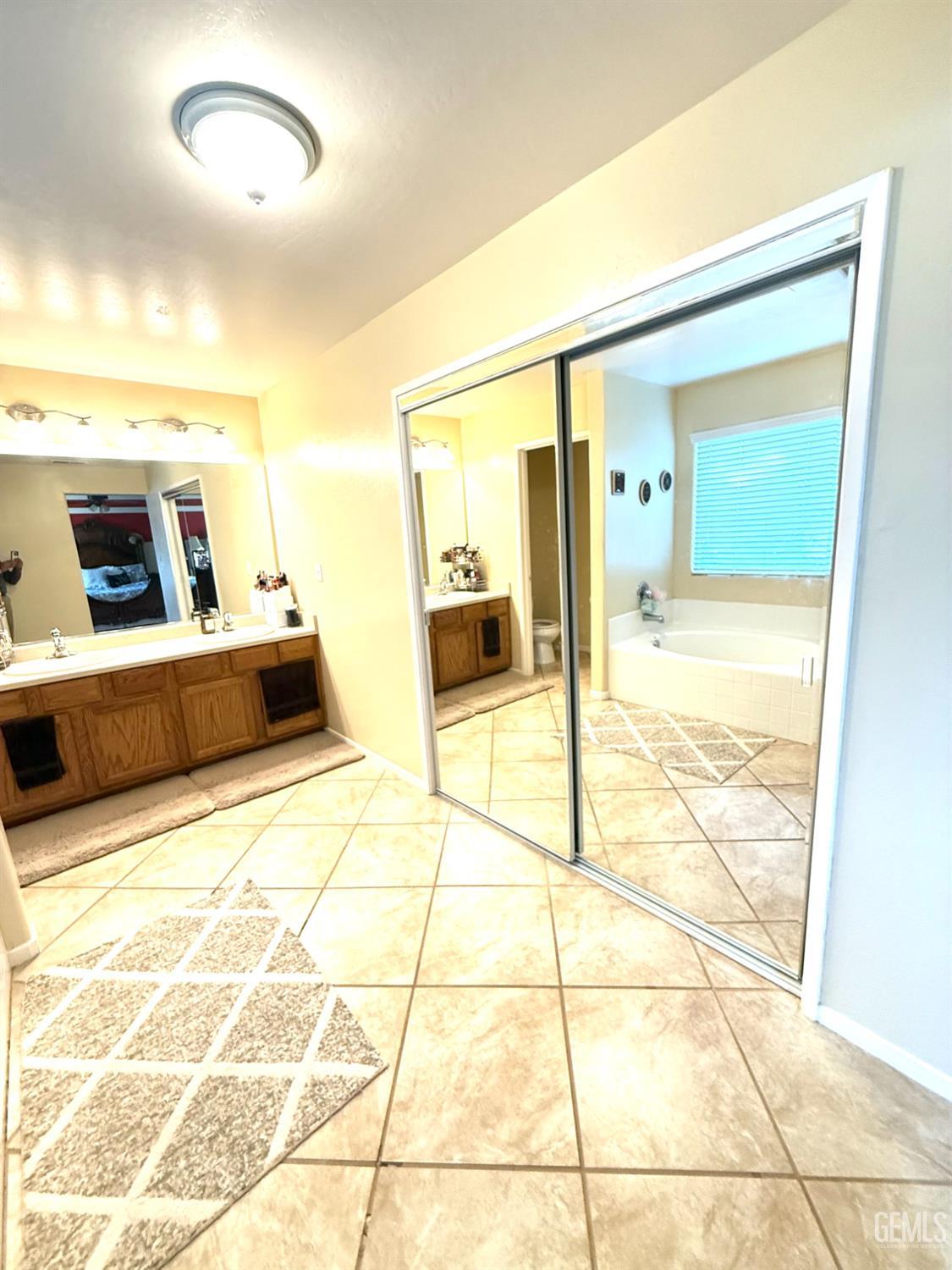 Undisclosed Address Bakersfield, CA 93311 - Photo 34 of 52 a bathroom with a sink and a mirror