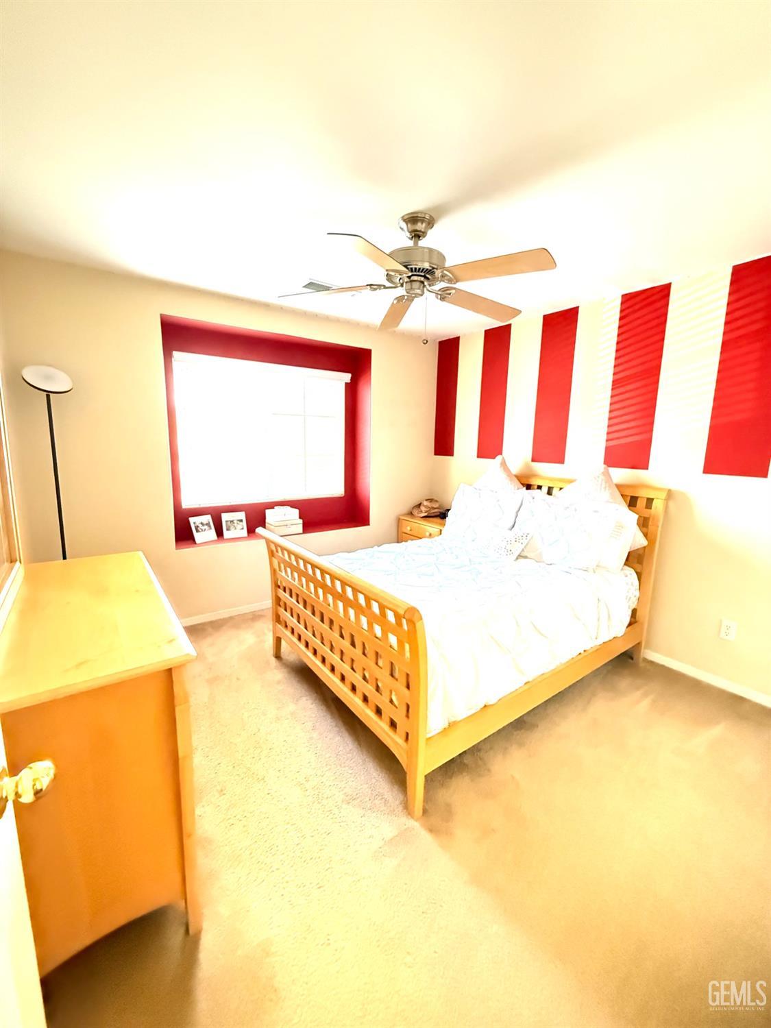 Undisclosed Address Bakersfield, CA 93311 - Photo 46 of 52 a bedroom with a bed and a window