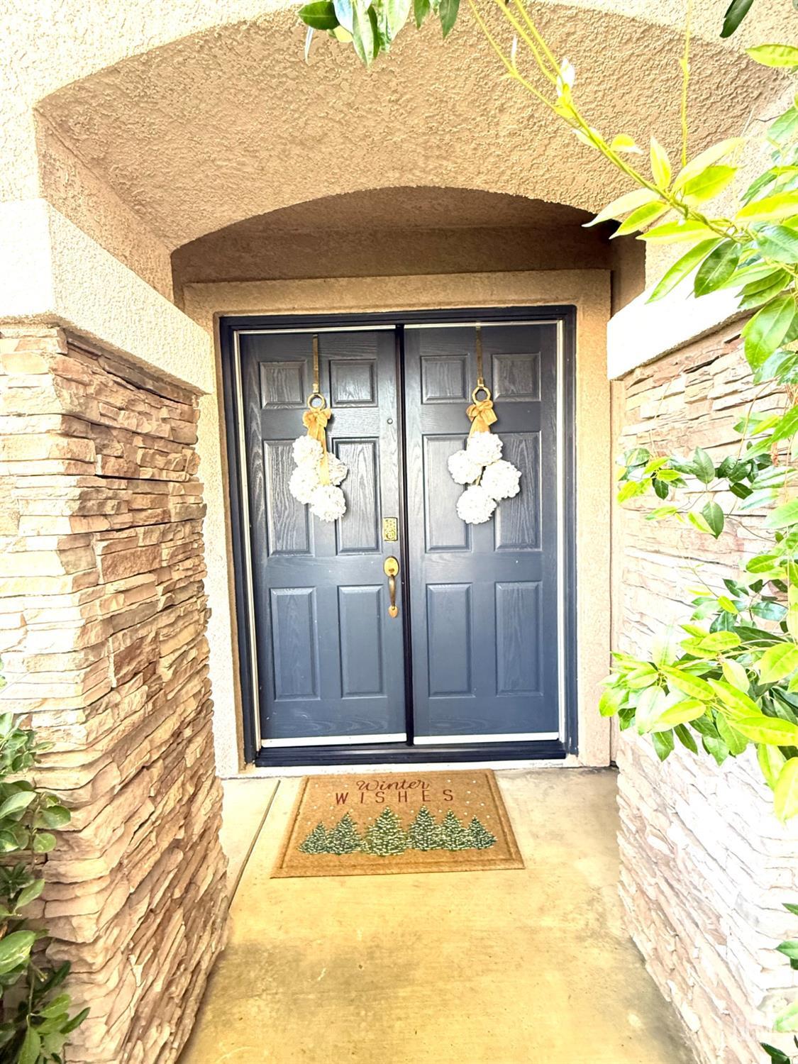 Undisclosed Address Bakersfield, CA 93311 - Photo 5 of 52 a view of front door of house