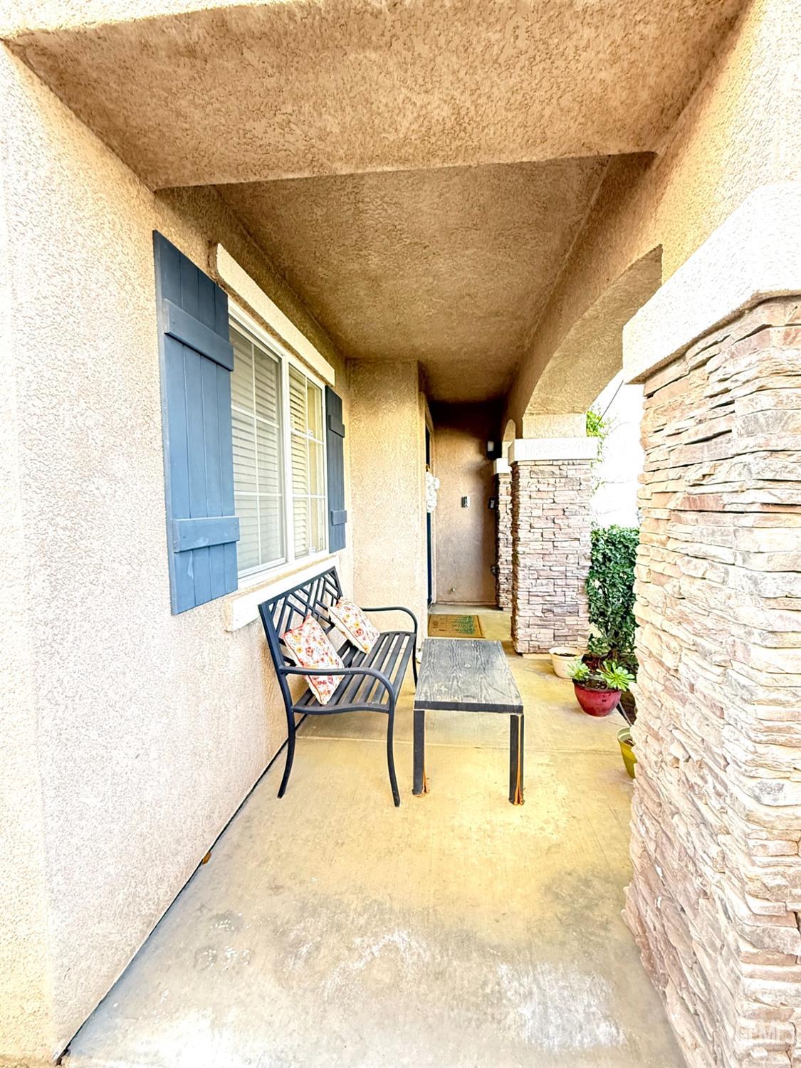 Undisclosed Address Bakersfield, CA 93311 - Photo 6 of 52 a balcony with chairs and with potted plants