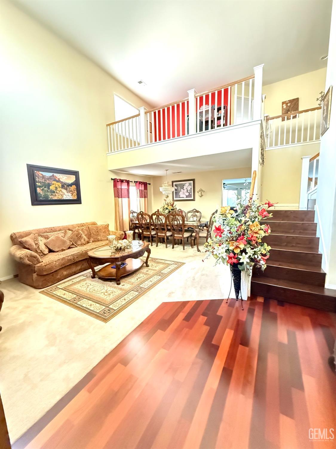 Undisclosed Address Bakersfield, CA 93311 - Photo 7 of 52 a living room with dining room and wooden floor