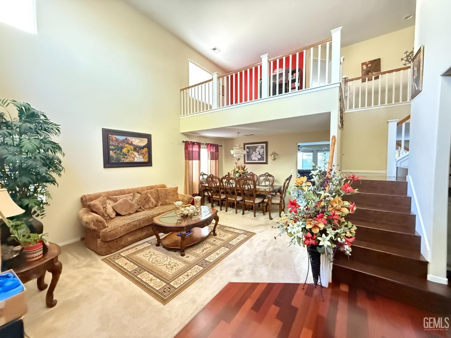 Undisclosed Address Bakersfield, CA 93311 - Photo 8 of 52 a living room with furniture flowerpot and wooden floor