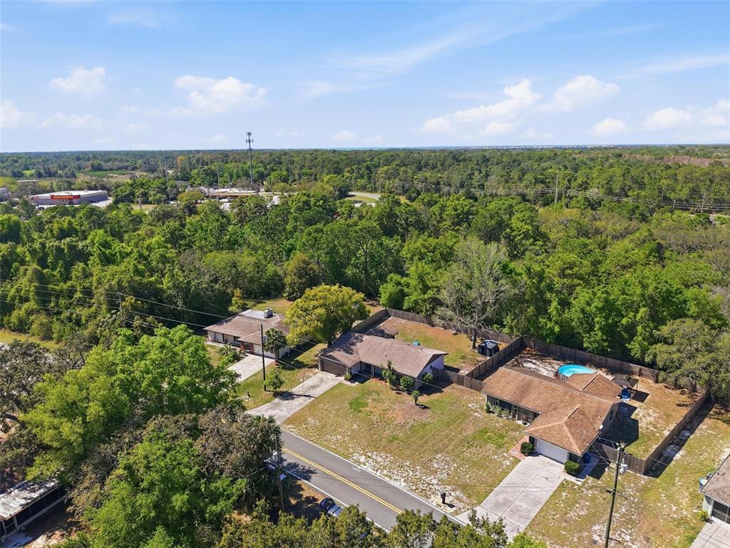 5485 Pinehurst Drive Spring Hill, FL 34606 - Photo 34 of 45 an aerial view of residential house with outdoor space
