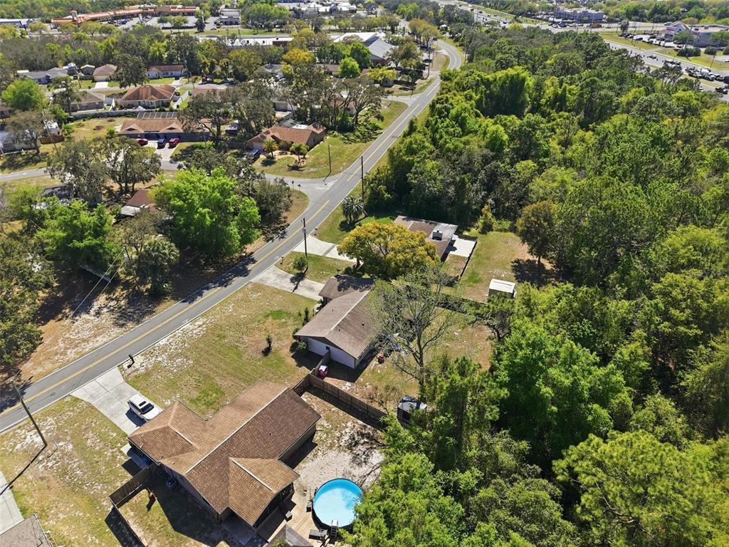5485 Pinehurst Drive Spring Hill, FL 34606 - Photo 36 of 45 an aerial view of residential house with outdoor space