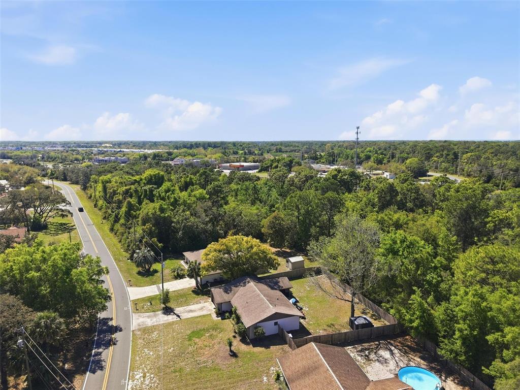 5485 Pinehurst Drive Spring Hill, FL 34606 - Photo 42 of 45 an aerial view of residential houses with outdoor space