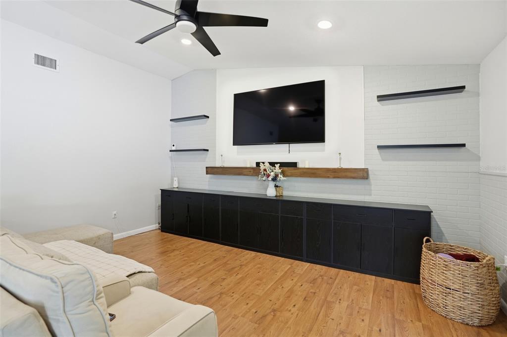 5485 Pinehurst Drive Spring Hill, FL 34606 - Photo 8 of 45 a bedroom with a bed and a flat screen tv