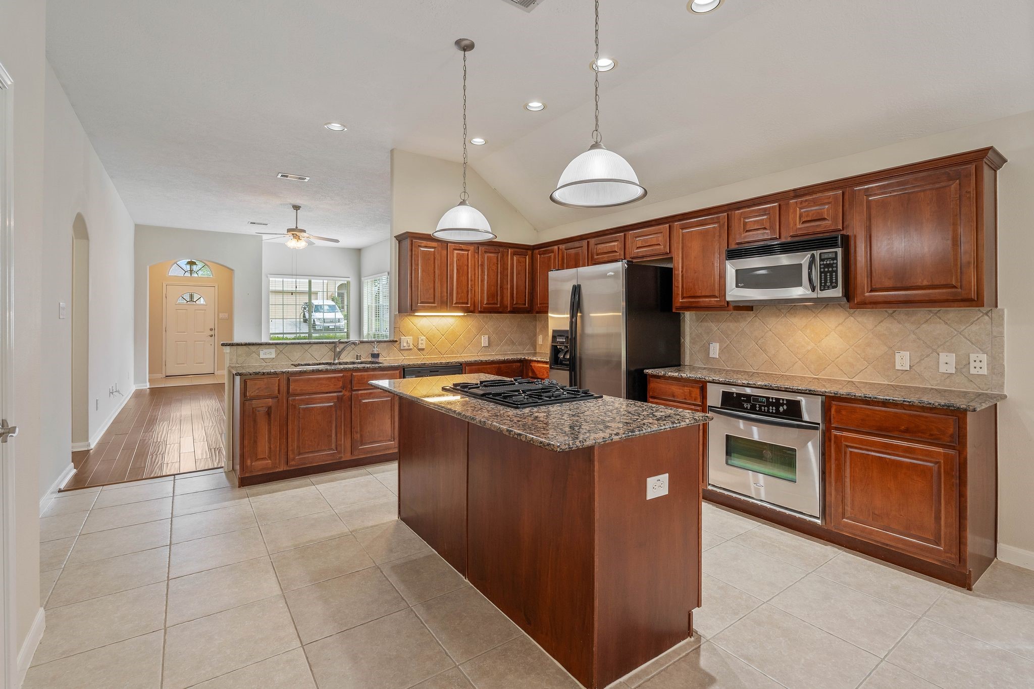 166 April Cove Montgomery, TX 77356 - Photo 13 of 37 Open kitchen and dining layout ideal for everyday living and hosting guests.