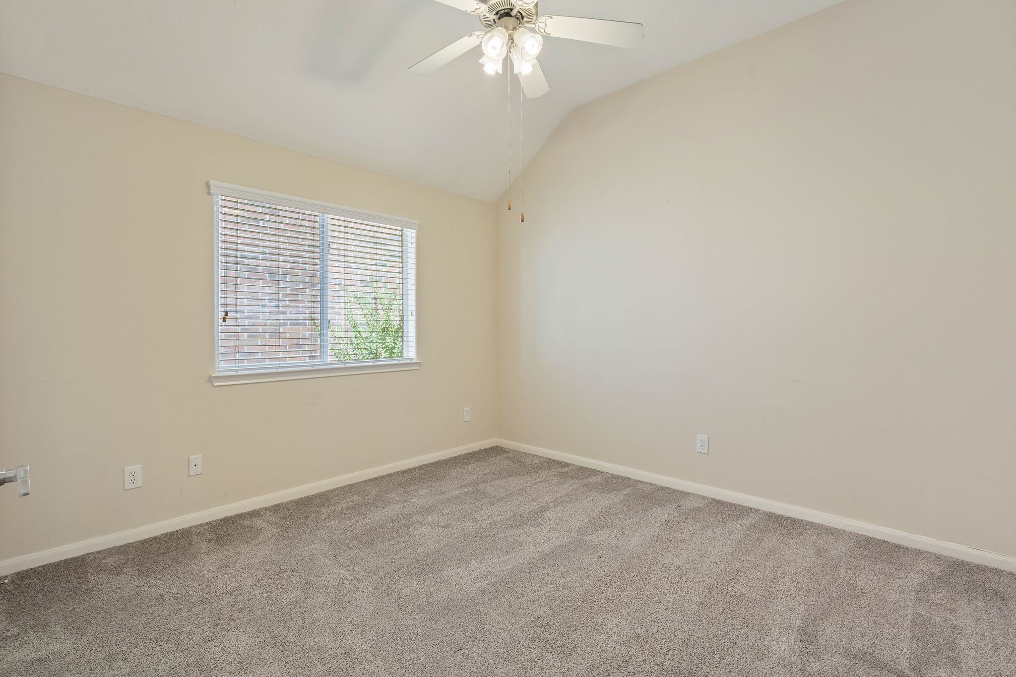 166 April Cove Montgomery, TX 77356 - Photo 23 of 37 Comfortable secondary bedroom with large windows and ample closet space.
