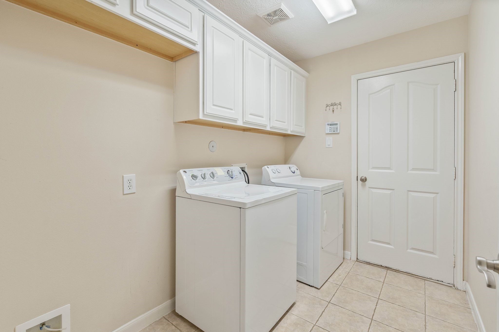166 April Cove Montgomery, TX 77356 - Photo 29 of 37 Dedicated utility room conveniently located inside the home with washer and dryer included.