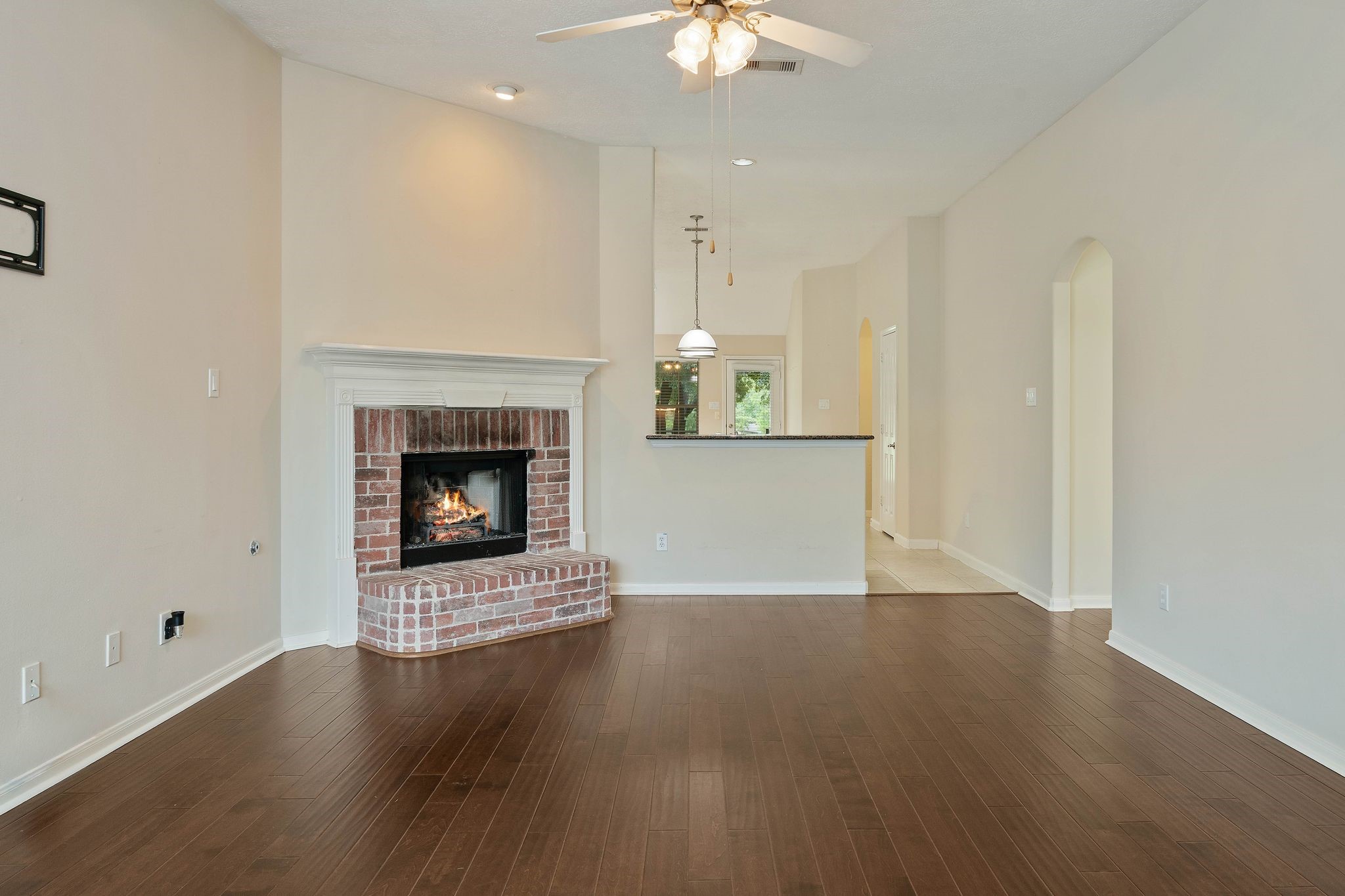 166 April Cove Montgomery, TX 77356 - Photo 9 of 37 Open-concept living space with seamless flow into the kitchen and dining area.