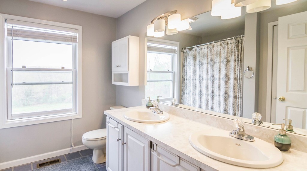 247 Town Farm Road Warren, MA 01083 - Photo 18 of 28 a bathroom with a sink toilet and a mirror
