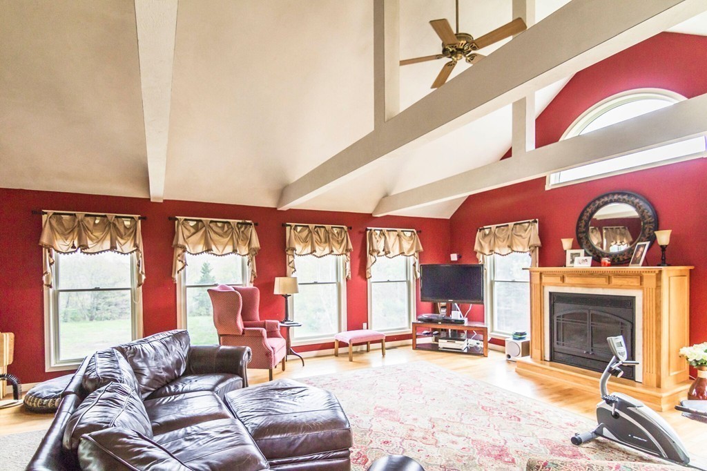 247 Town Farm Road Warren, MA 01083 - Photo 8 of 28 a living room with furniture a fireplace and a large window