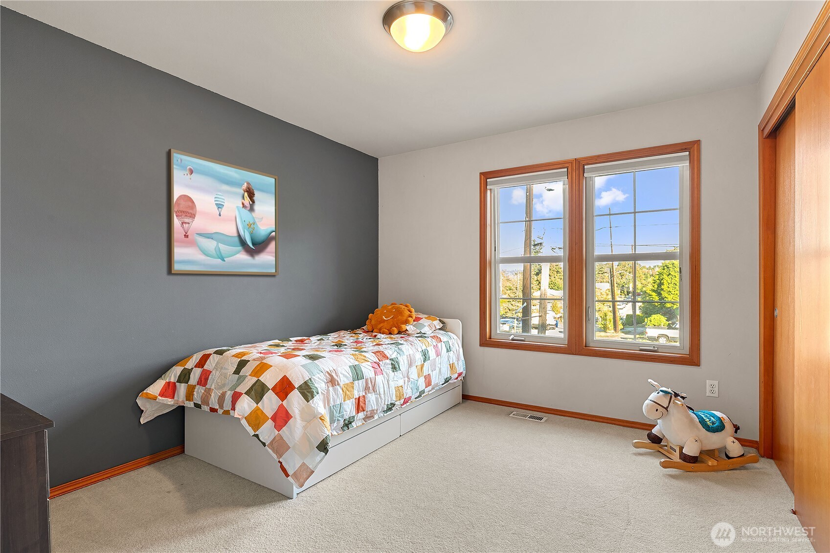 9301 53rd Avenue South Seattle, WA 98118 - Photo 13 of 25 a bedroom with a bed and a window