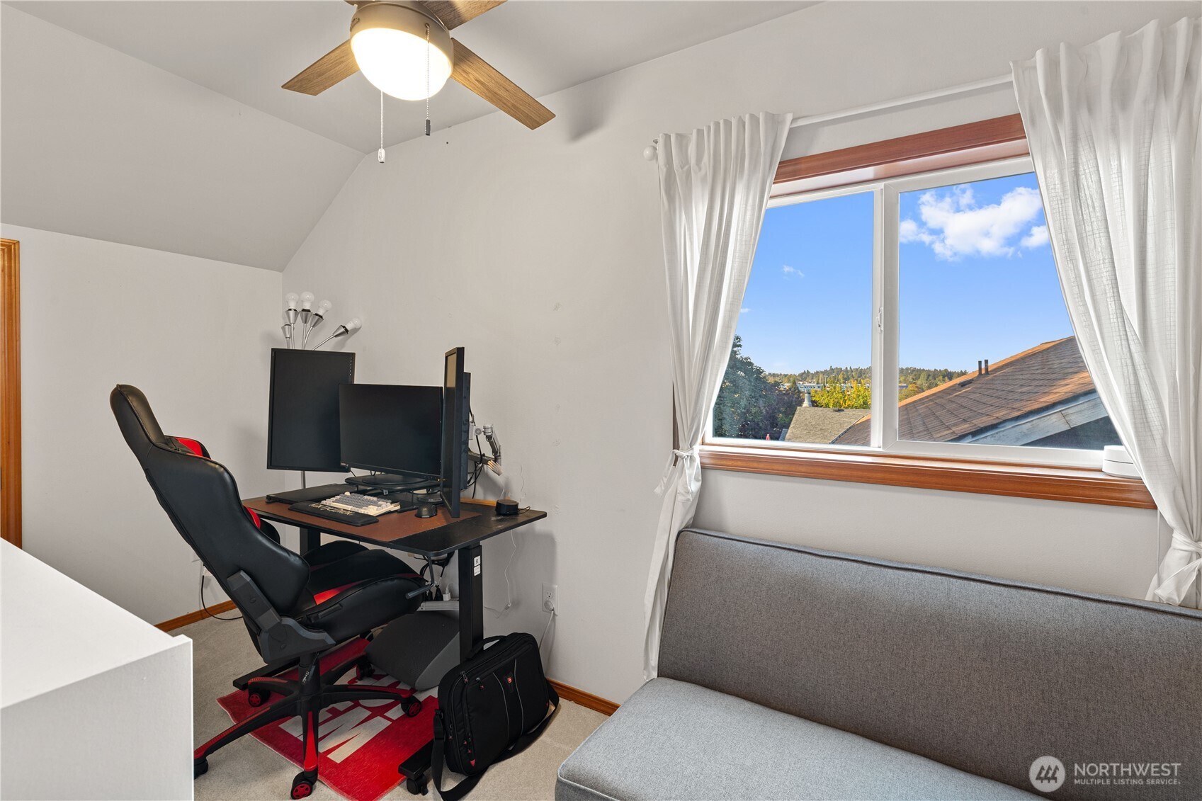 9301 53rd Avenue South Seattle, WA 98118 - Photo 19 of 25 a view of a workspace with furniture and a window