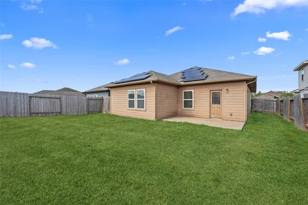 a view of a backyard with a small cabin