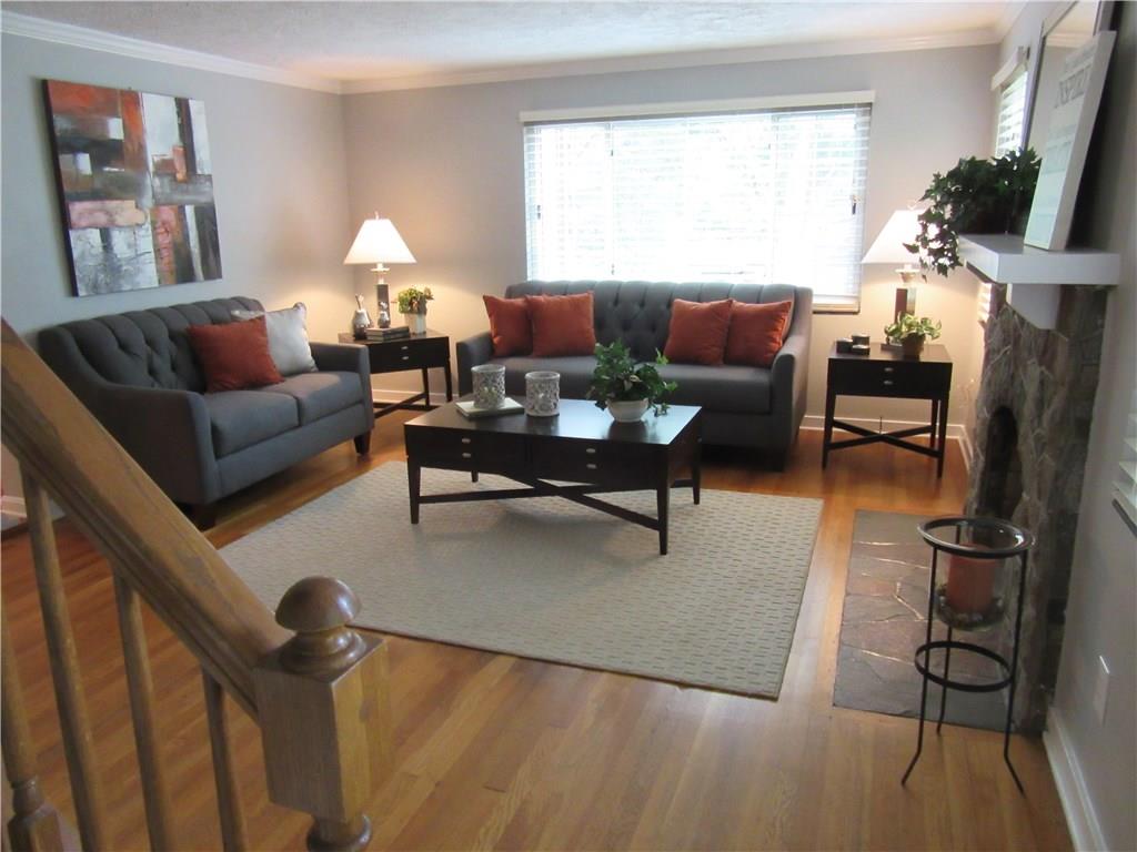 3329 Comanche Road Pittsburgh, PA 15241 - Photo 3 of 25 Living room with hardwood floor and three windows that flood the room with natural light.