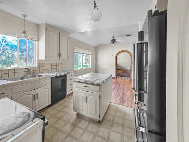 a view of a hallway to rooms