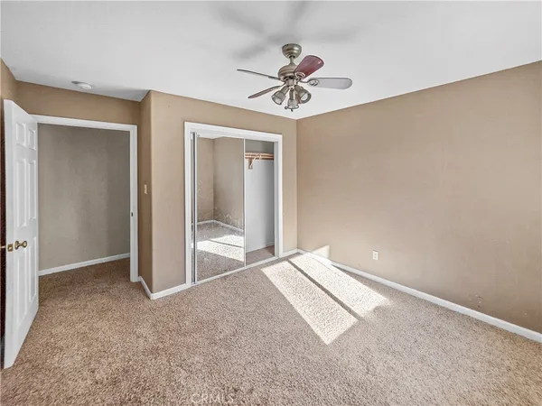 a very nice looking room with a ceiling fan