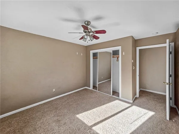a bathroom with a sink toilet and window