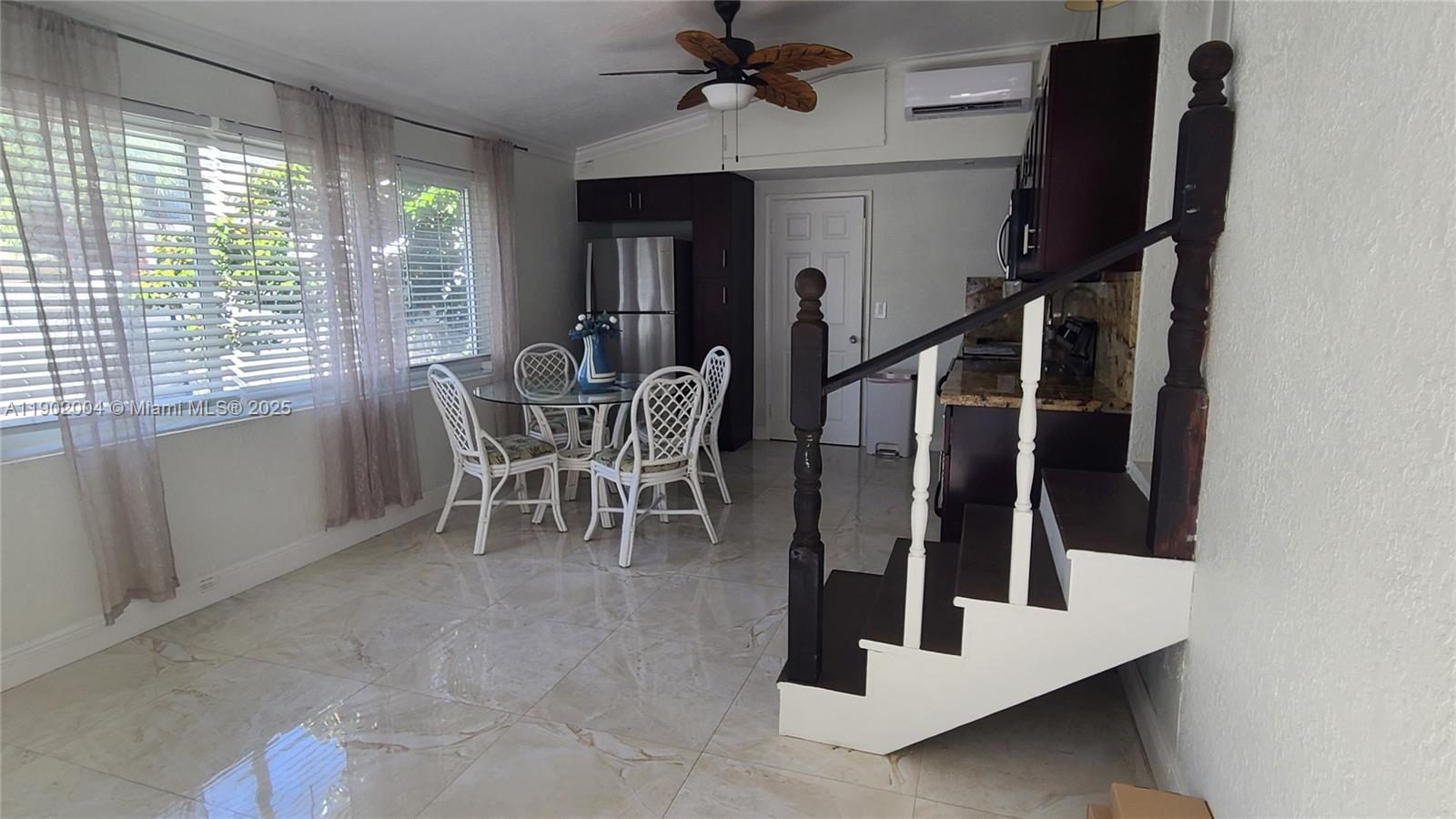3221 Northeast 7th Street, Unit 2 Pompano Beach, FL 33062 - Photo 3 of 10 a dining room with furniture and window