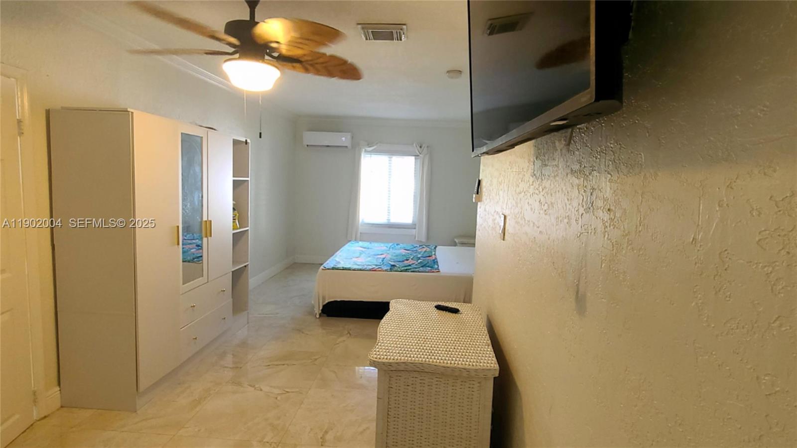3221 Northeast 7th Street, Unit 2 Pompano Beach, FL 33062 - Photo 6 of 10 a bathroom with a sink and mirror