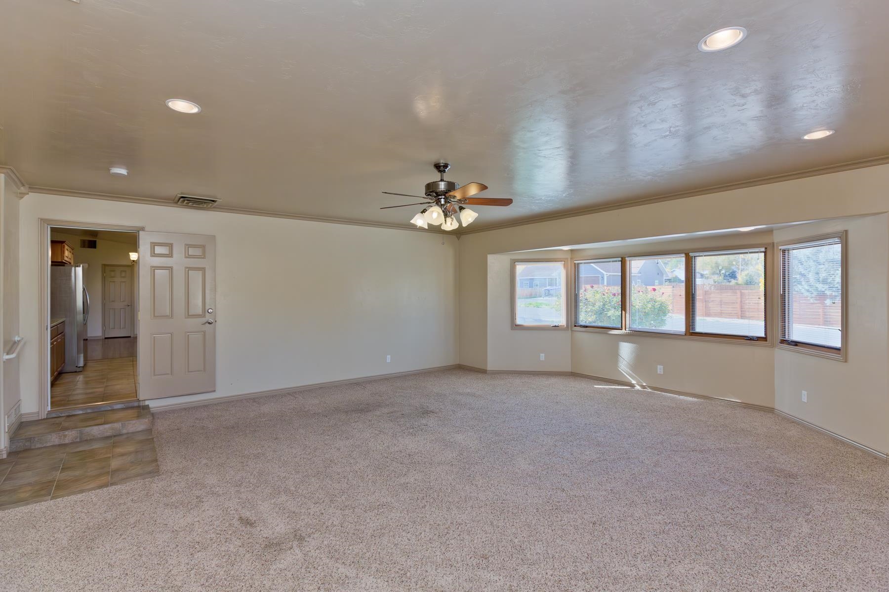 431 Pleasant Ridge Lane, Unit A Grand Junction, CO 81507 - Photo 15 of 29 a view of an empty room with a window