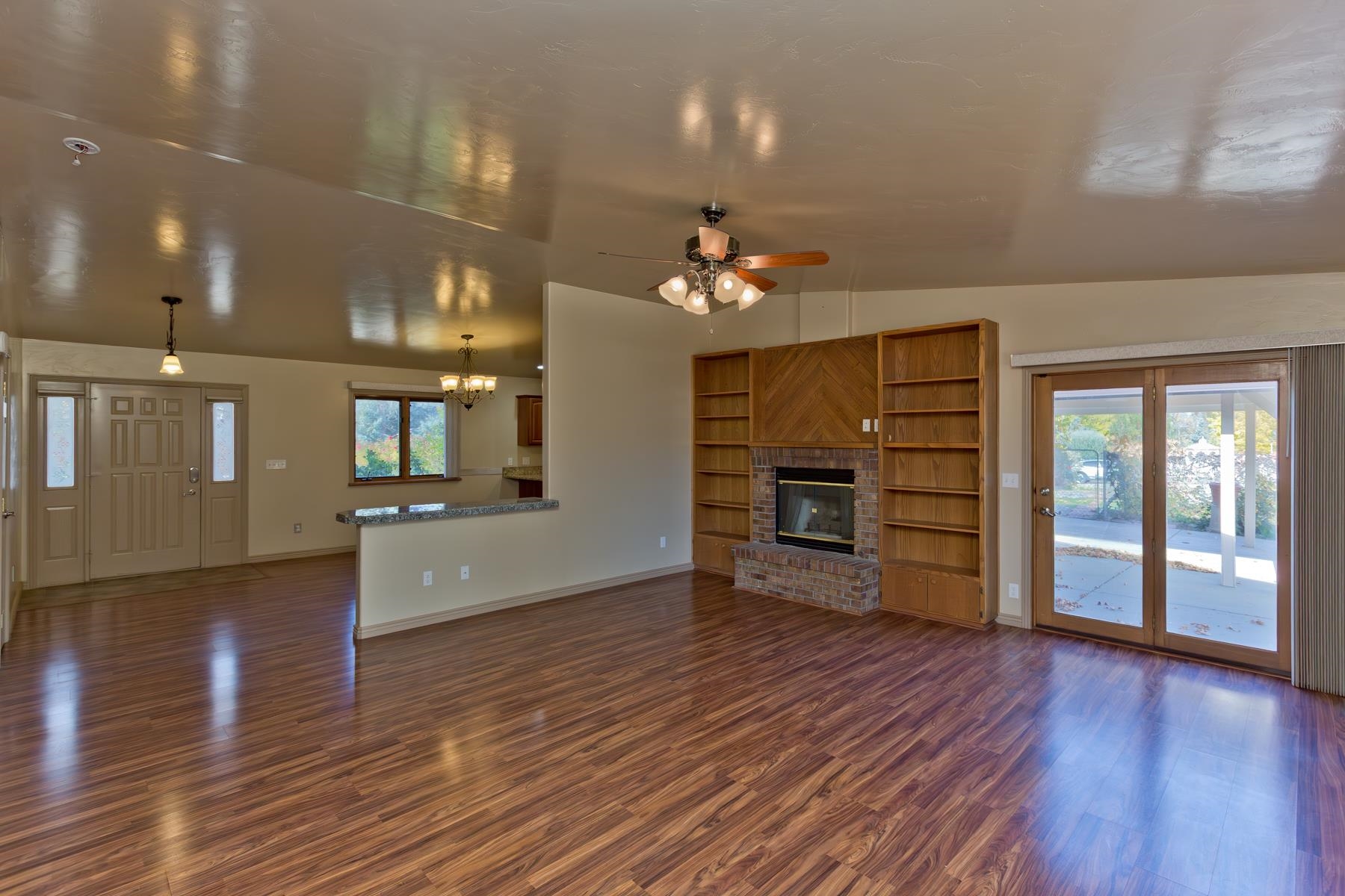 431 Pleasant Ridge Lane, Unit A Grand Junction, CO 81507 - Photo 17 of 29 a view of a room with wooden floor and flat screen tv