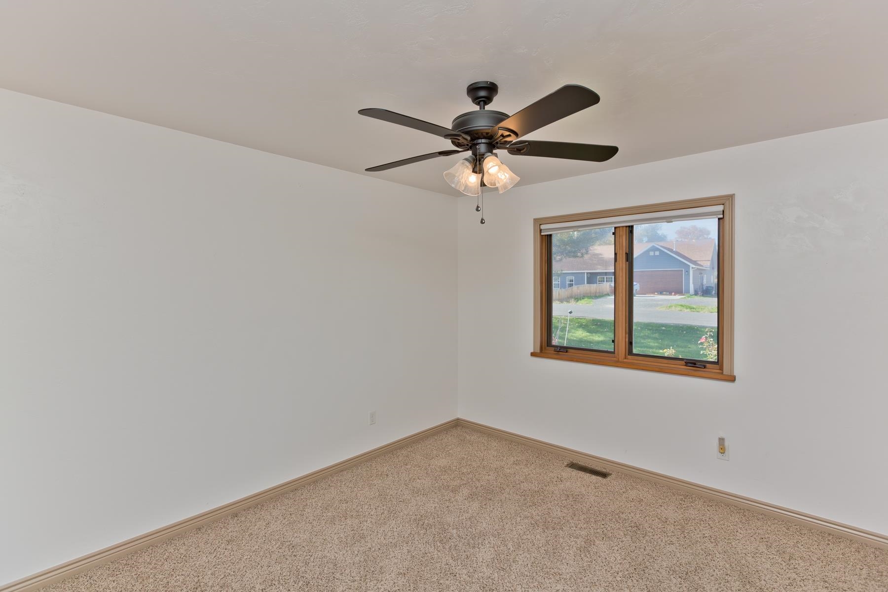 431 Pleasant Ridge Lane, Unit A Grand Junction, CO 81507 - Photo 18 of 29 an empty room with a window and a fan