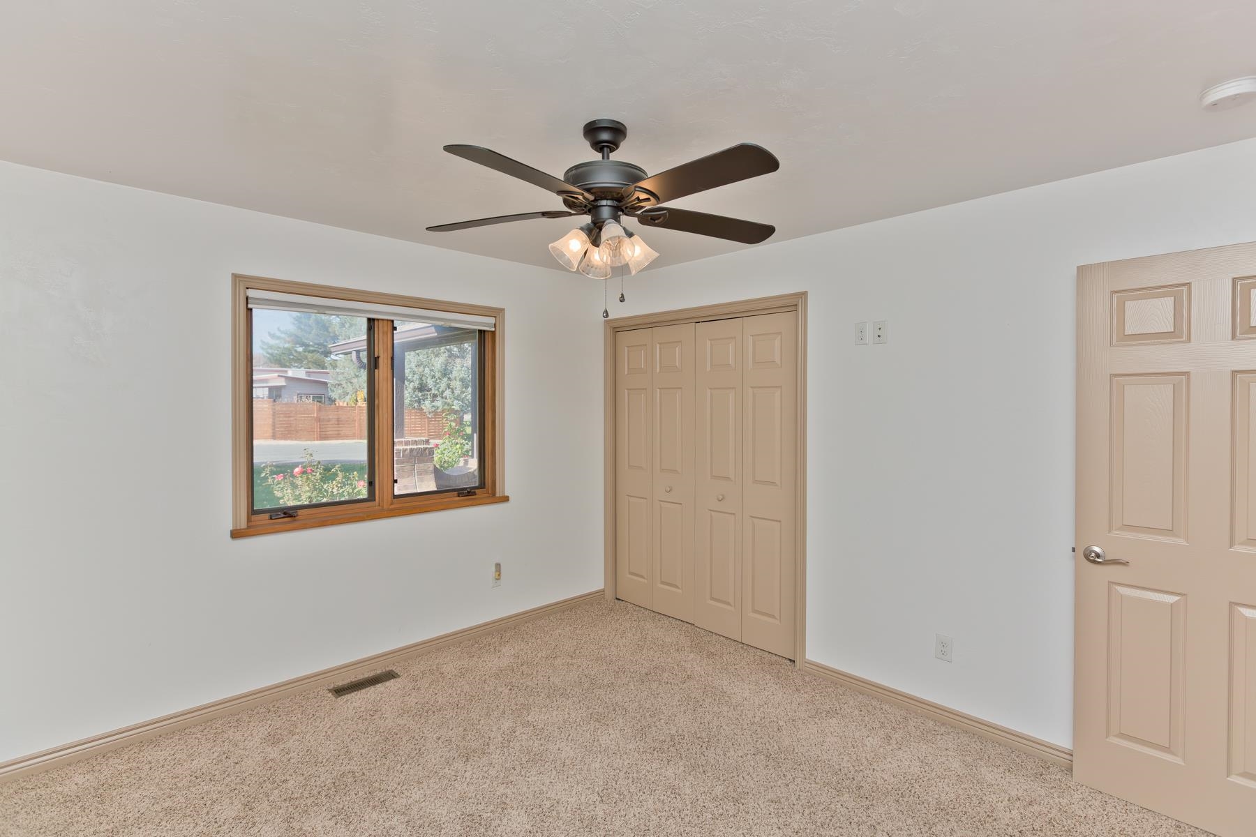 431 Pleasant Ridge Lane, Unit A Grand Junction, CO 81507 - Photo 19 of 29 a view of a livingroom with a ceiling fan and window