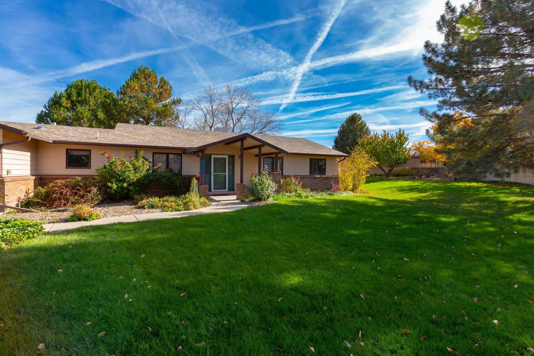 431 Pleasant Ridge Lane, Unit A Grand Junction, CO 81507 - Photo 2 of 29 a front view of a house with garden