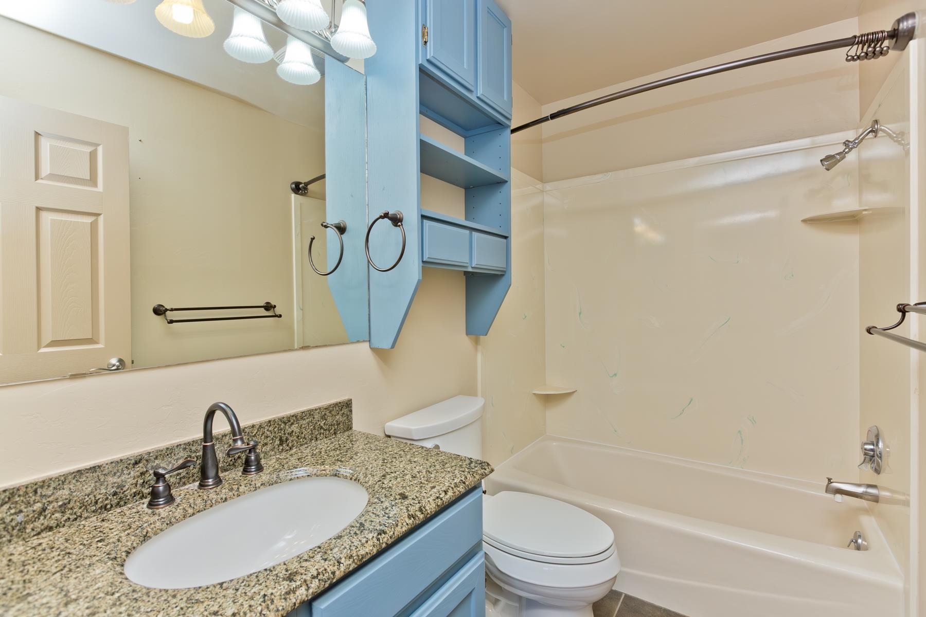 431 Pleasant Ridge Lane, Unit A Grand Junction, CO 81507 - Photo 21 of 29 a bathroom with a granite countertop sink toilet and shower
