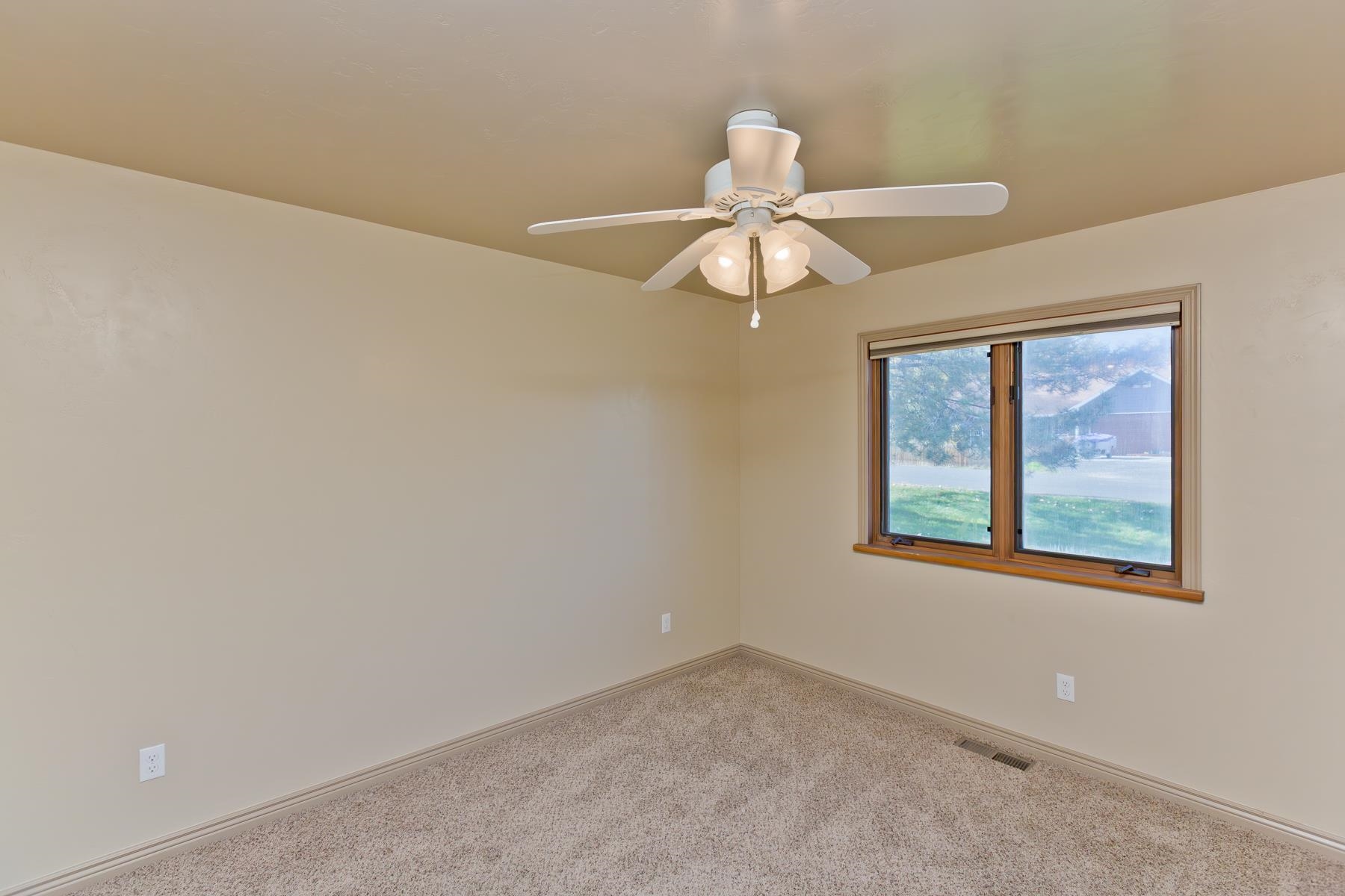 431 Pleasant Ridge Lane, Unit A Grand Junction, CO 81507 - Photo 23 of 29 a view of an empty room with a window
