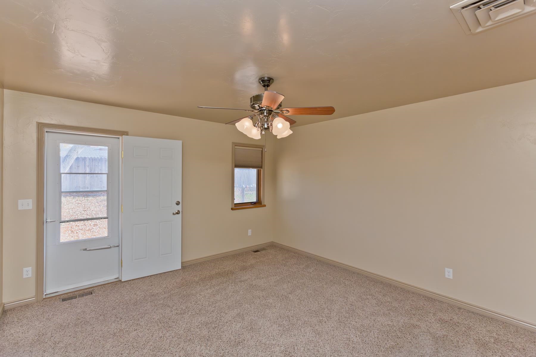 431 Pleasant Ridge Lane, Unit A Grand Junction, CO 81507 - Photo 24 of 29 wooden floor in an empty room with a window