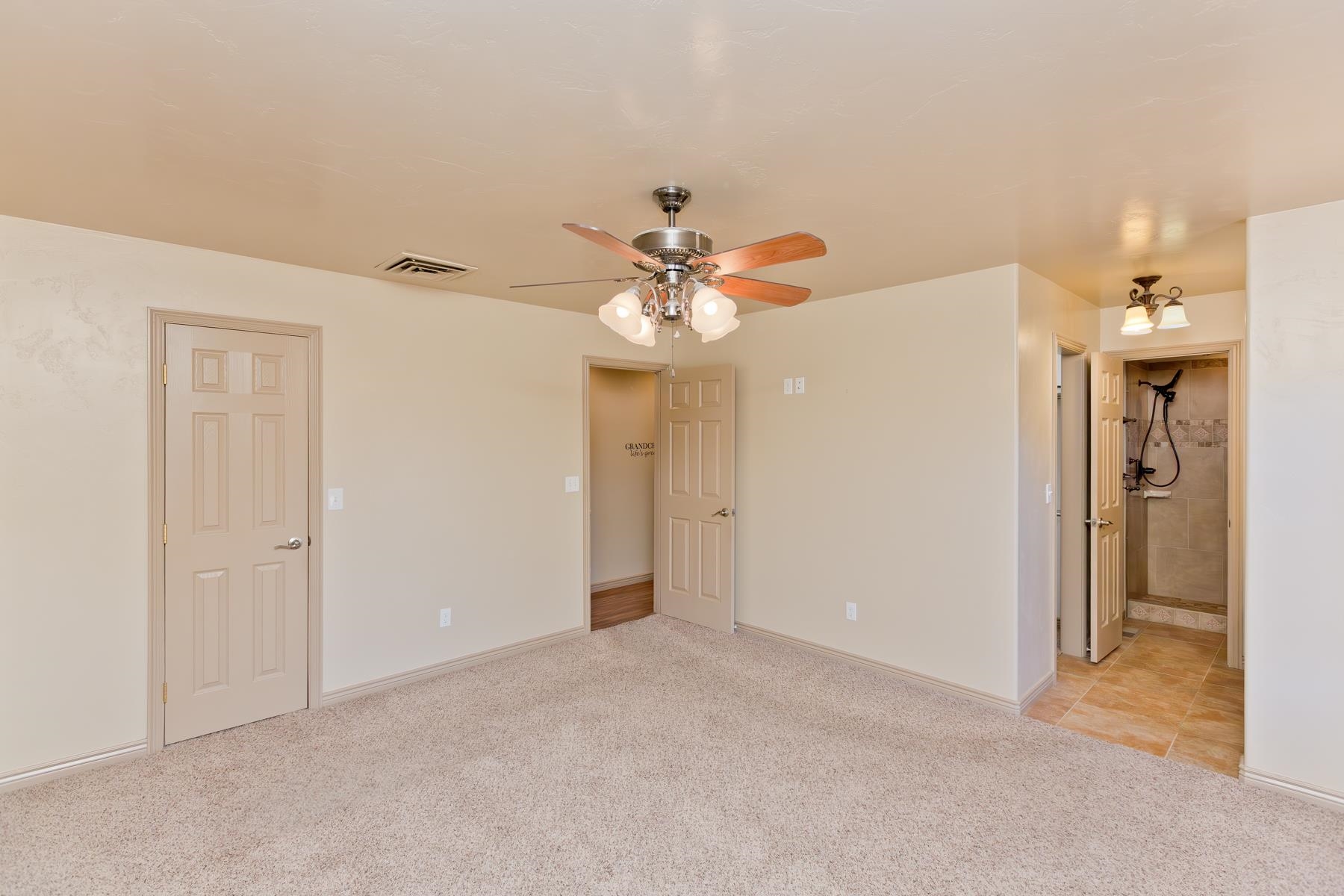 431 Pleasant Ridge Lane, Unit A Grand Junction, CO 81507 - Photo 25 of 29 a view of a chandelier fan and entryway