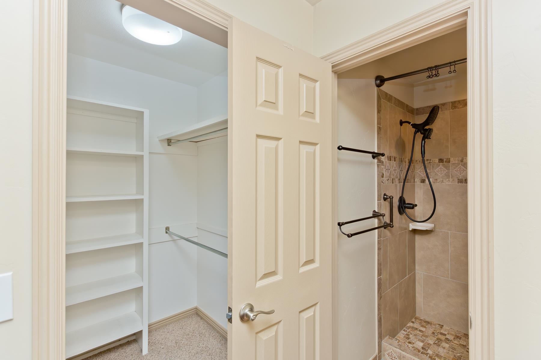 431 Pleasant Ridge Lane, Unit A Grand Junction, CO 81507 - Photo 28 of 29 a bathroom with a glass shower door