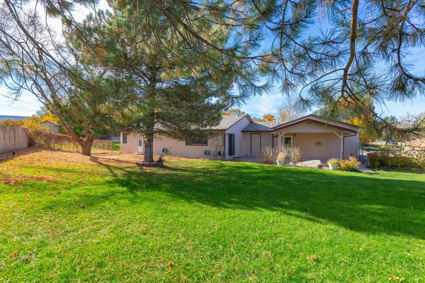 431 Pleasant Ridge Lane, Unit A Grand Junction, CO 81507 - Photo 4 of 29 a view of a house with a backyard