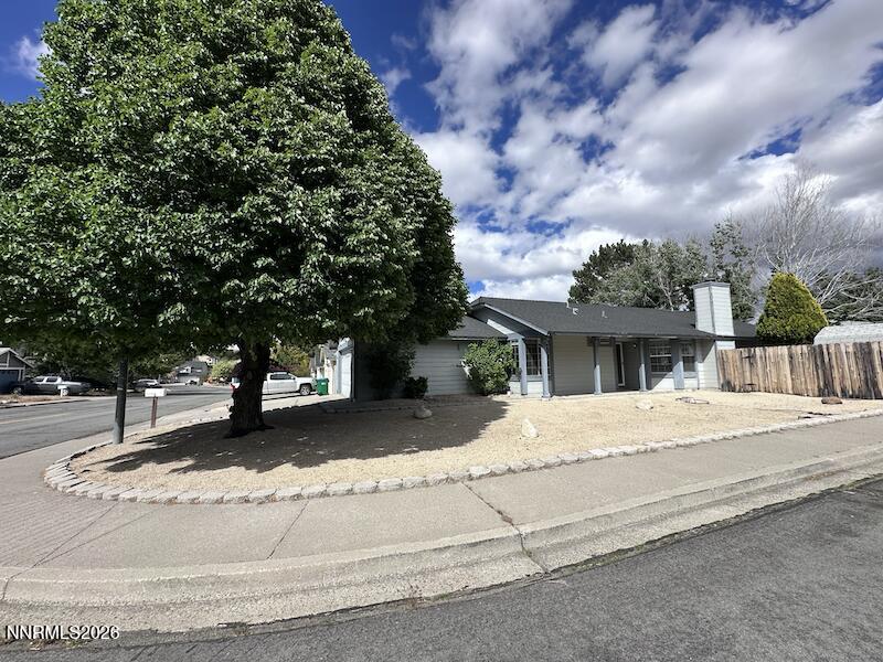 1182 Blue Lakes Road Reno, NV 89523 - Photo 2 of 31 a house with trees in front of it