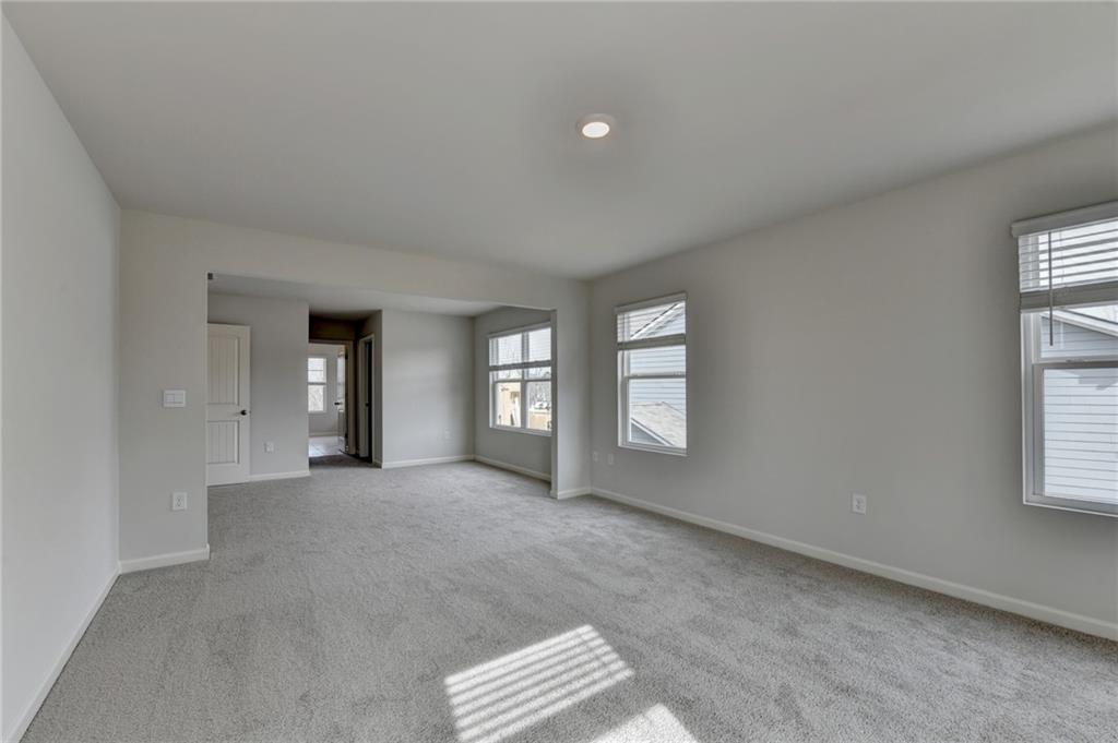 4067 Peregrine Way Gainesville, GA 30506 - Photo 16 of 52 a view of an empty room with a window
