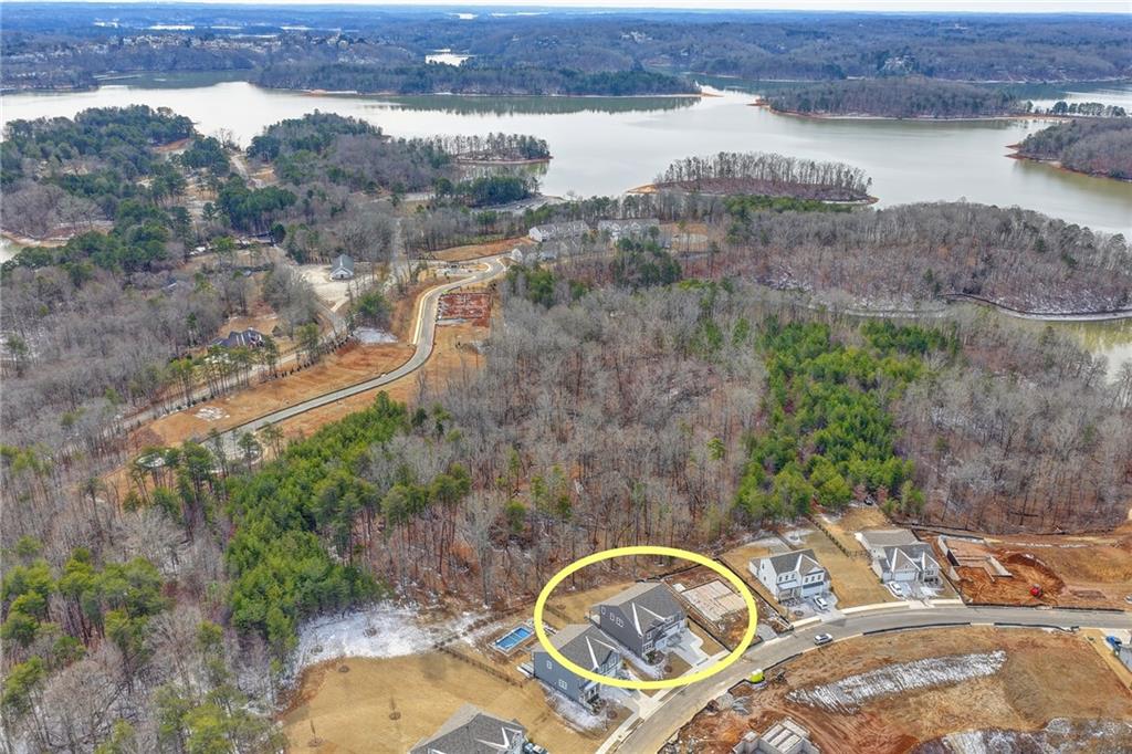 4067 Peregrine Way Gainesville, GA 30506 - Photo 33 of 52 an aerial view of a house with a lake view