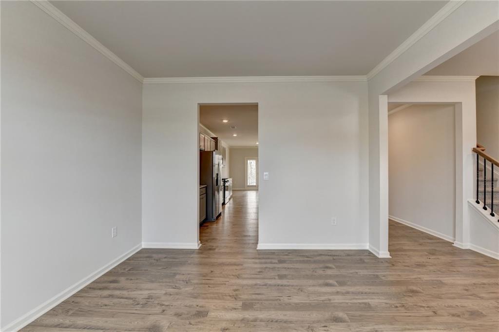 4067 Peregrine Way Gainesville, GA 30506 - Photo 41 of 52 a view of a room with wooden floor