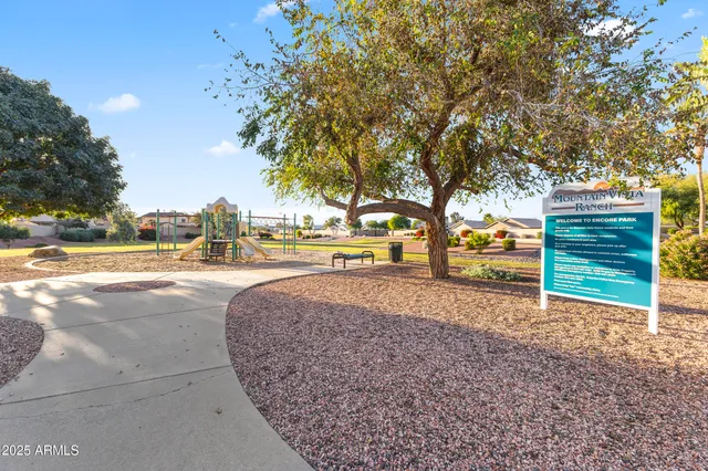 a view of outdoor space with garden and trees