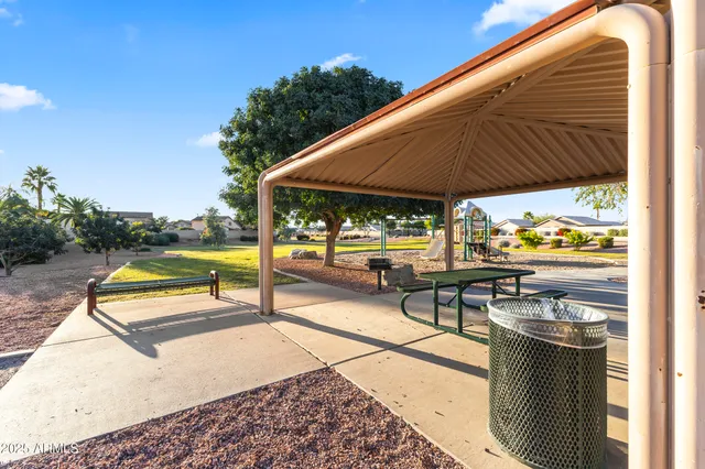 a view of a swimming pool with a patio