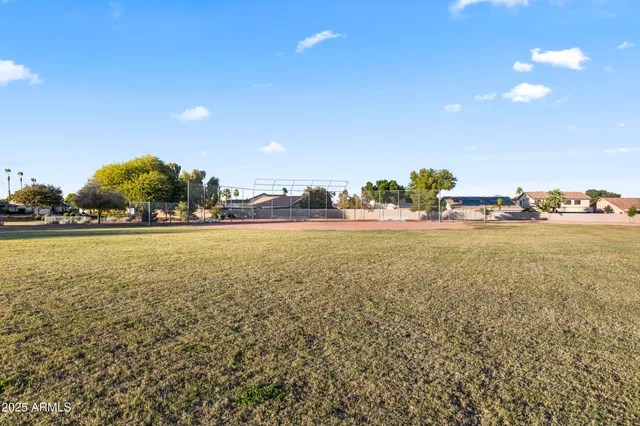 a view of a park with swings and slides