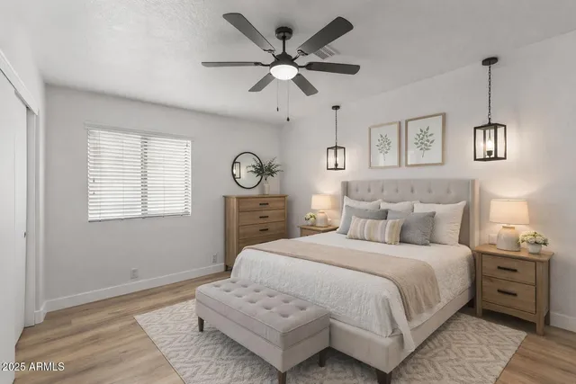 a bedroom with a large bed and a window