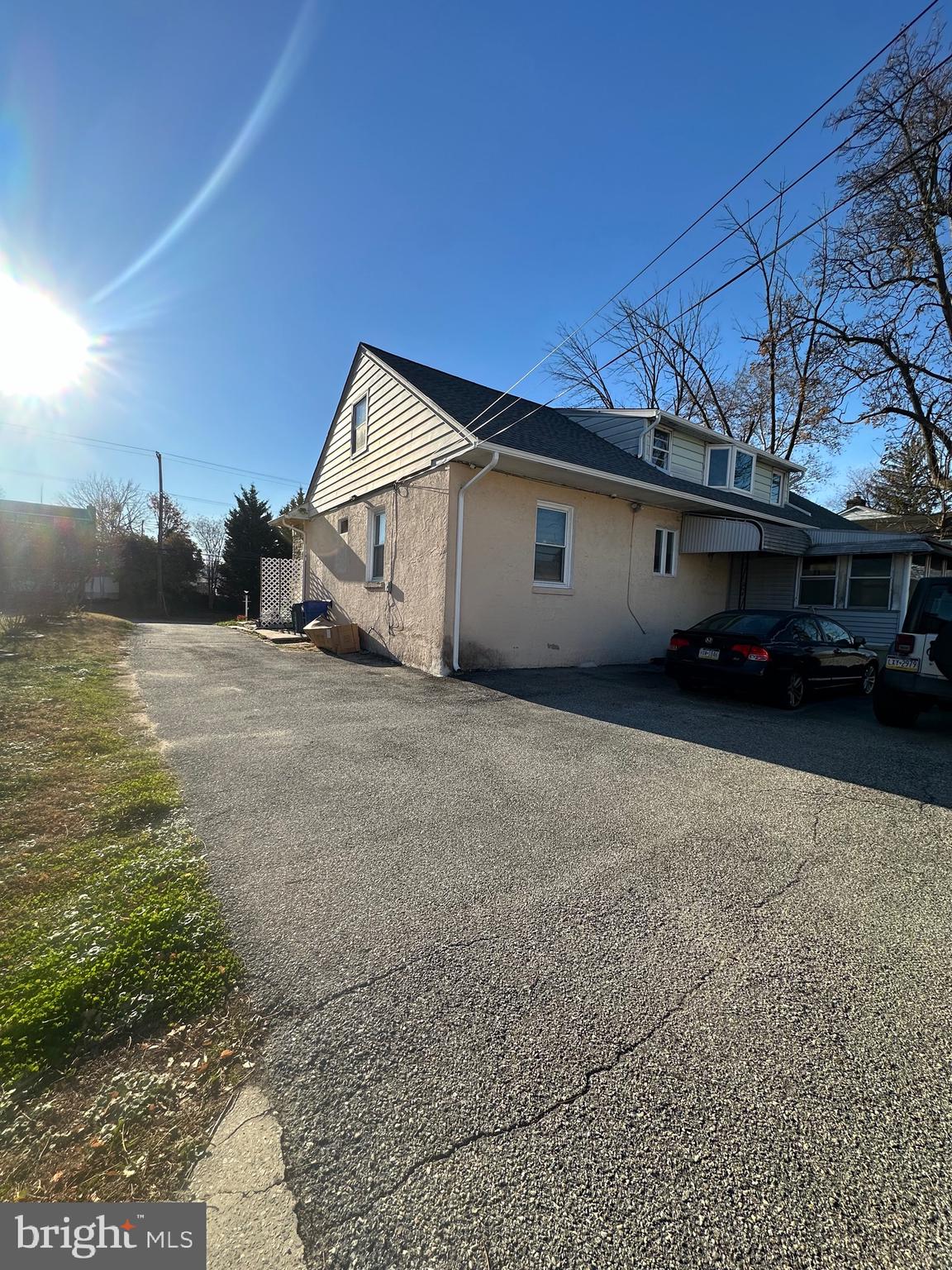 221 West Chester Pike, Unit B Ridley Park, PA 19078 - Photo 18 of 18 a view of a car in front of a house