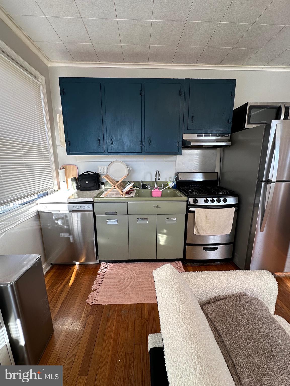 221 West Chester Pike, Unit B Ridley Park, PA 19078 - Photo 4 of 18 a kitchen with stainless steel appliances a sink stove and cabinets