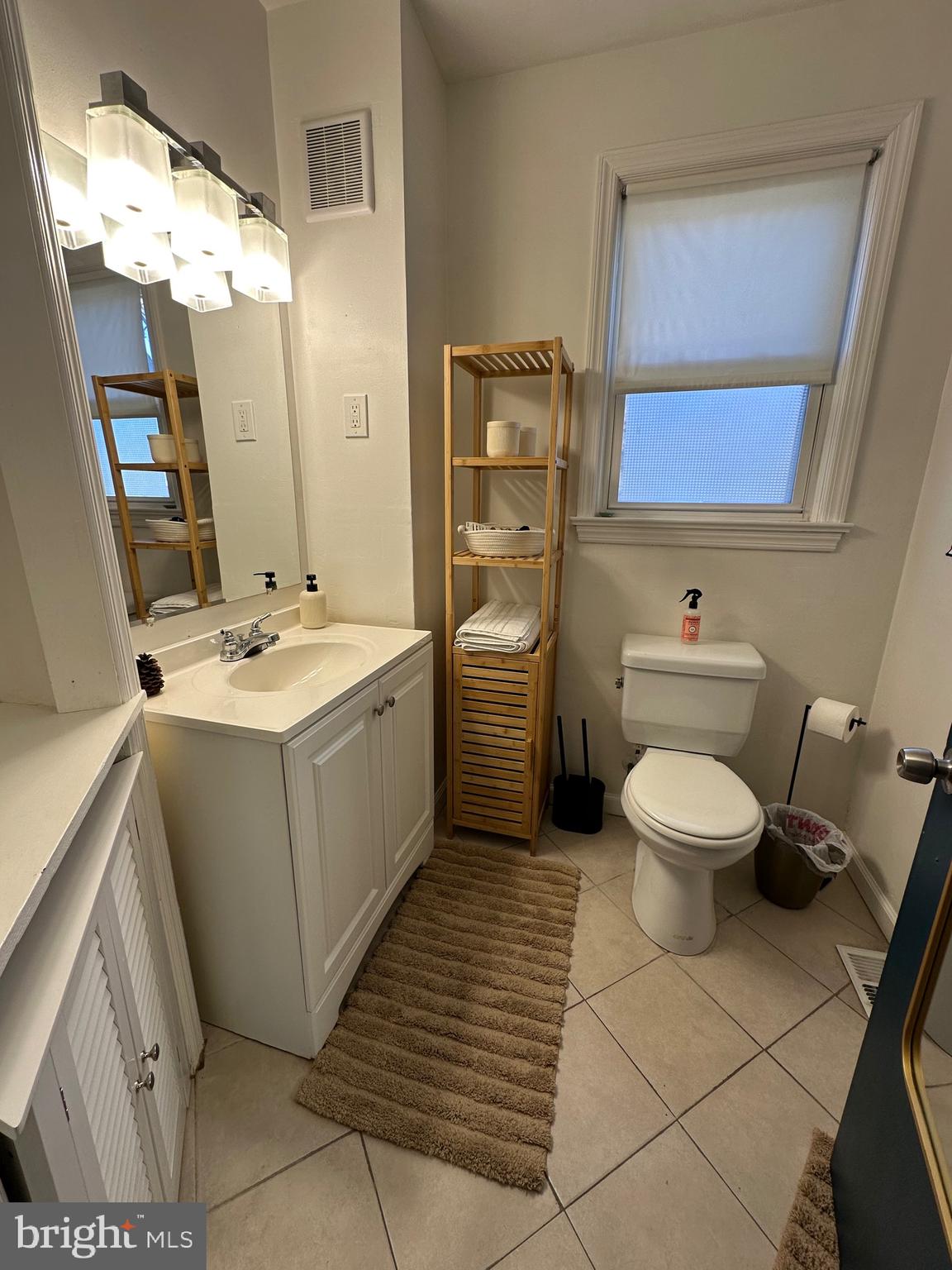221 West Chester Pike, Unit B Ridley Park, PA 19078 - Photo 5 of 18 a bathroom with a toilet sink and mirror