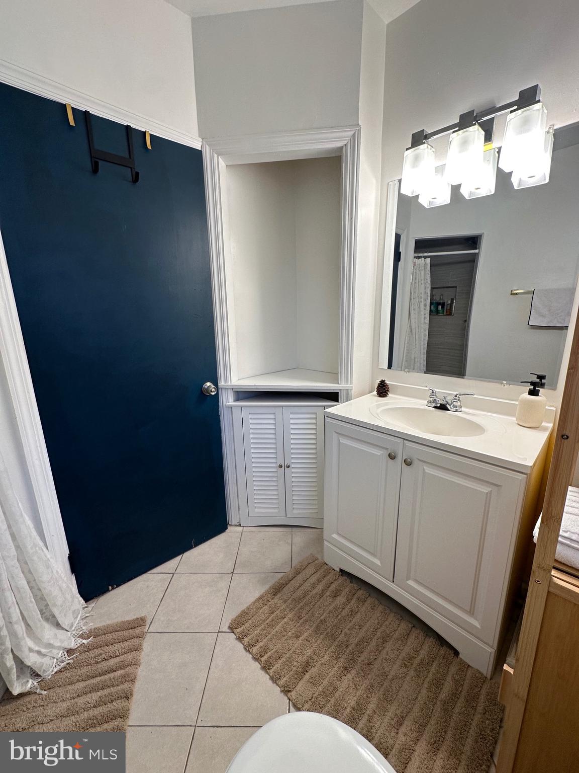 221 West Chester Pike, Unit B Ridley Park, PA 19078 - Photo 7 of 18 a bathroom with a sink and a mirror