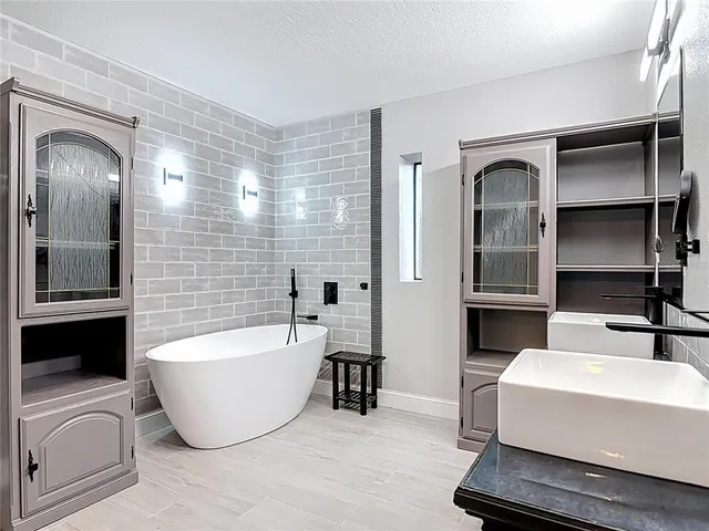 a kitchen with a sink and a refrigerator