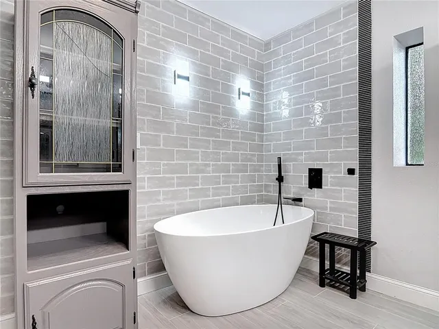 a bathroom with a shower and a toilet